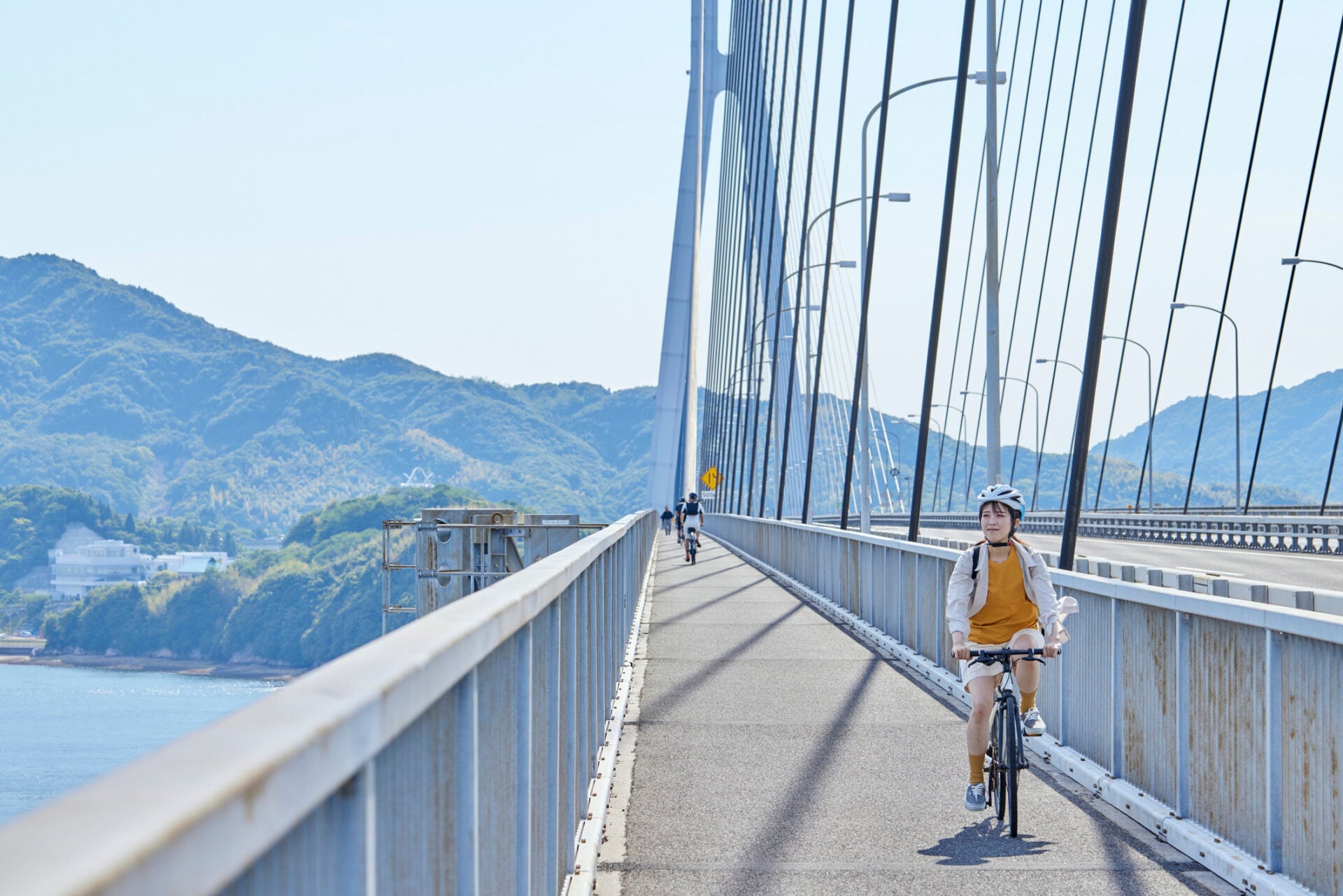 A japanese woman who enjoys cycling on the Shimanami Kaido herself